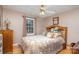 Spacious bedroom with wood flooring and patterned bedding at 1318 Gum Branch Rd, Charlotte, NC 28214