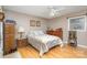 Well-lit bedroom with double dresser and ceiling fan at 1318 Gum Branch Rd, Charlotte, NC 28214