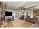 Living room with hardwood floors, fireplace, and French doors at 1318 Gum Branch Rd, Charlotte, NC 28214