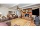 Spacious living room with fireplace and hardwood floors at 1318 Gum Branch Rd, Charlotte, NC 28214