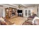 Living room features a brick fireplace and French doors at 1318 Gum Branch Rd, Charlotte, NC 28214