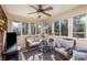 Relaxing sunroom with wicker furniture and exercise bike at 1318 Gum Branch Rd, Charlotte, NC 28214