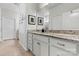 Bathroom with granite counters, white cabinets, and tile floors at 132 Picasso Trl, Mount Holly, NC 28120