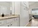 Bathroom vanity featuring granite counters, white cabinets, and modern hardware at 132 Picasso Trl, Mount Holly, NC 28120