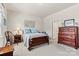 Bright bedroom featuring carpet, neutral paint, and natural light from the window at 132 Picasso Trl, Mount Holly, NC 28120