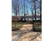 Community common area by the lake, featuring a serene seating spot with beautiful lake view at 132 Picasso Trl, Mount Holly, NC 28120