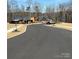 A view of the community construction site showcasing building activity with new construction and landscaping at 132 Picasso Trl, Mount Holly, NC 28120