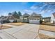 Inviting single-Gathering home featuring a two-car garage and well-manicured lawn at 132 Picasso Trl, Mount Holly, NC 28120