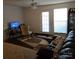 Living room with a brown couch, chair, and TV at 14 Hamiltons Bay Ct # 528, Lake Wylie, SC 29710