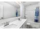 Modern bathroom featuring double sinks, a large mirror, and a shower-tub combo with a blue shower curtain at 1433 Harleston St, Indian Trail, NC 28079