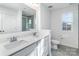 Modern bathroom features a double sink vanity with a large mirror and sleek finishes, next to a toilet and shower at 1433 Harleston St, Indian Trail, NC 28079