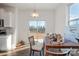 Dining area featuring sliding glass doors offering backyard access, located adjacent to the kitchen at 1433 Harleston St, Indian Trail, NC 28079