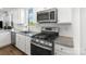 Kitchen showcasing granite counters, stainless steel appliances, and white subway tile backsplash at 1433 Harleston St, Indian Trail, NC 28079