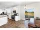 Bright kitchen featuring granite counters, stainless steel appliances, and a sliding glass door to the outside at 1433 Harleston St, Indian Trail, NC 28079