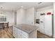 Spacious kitchen featuring a large island with granite countertops and stainless steel appliances at 1433 Harleston St, Indian Trail, NC 28079