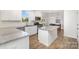 Kitchen featuring stainless steel appliances, granite counters, island, and view to dinette area at 1433 Harleston St, Indian Trail, NC 28079