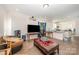 Open living space flowing into kitchen with modern appliances and a large center island at 1433 Harleston St, Indian Trail, NC 28079