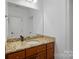 Simple bathroom with single vanity and granite countertop at 20517 Queensdale Dr, Cornelius, NC 28031