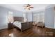 Bright bedroom with hardwood floors, large windows and plantation shutters at 20517 Queensdale Dr, Cornelius, NC 28031