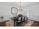 Formal dining room with chandelier, hardwood floors, and large windows at 20517 Queensdale Dr, Cornelius, NC 28031