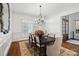 Formal dining room with chandelier and view of entryway at 20517 Queensdale Dr, Cornelius, NC 28031