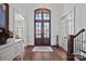 Elegant entryway with hardwood floors, double doors, and a charming console table at 20517 Queensdale Dr, Cornelius, NC 28031