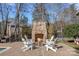 Stone fireplace with seating area for outdoor enjoyment at 20517 Queensdale Dr, Cornelius, NC 28031