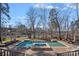 Stunning pool and spa with a lake view and plenty of lounge space at 20517 Queensdale Dr, Cornelius, NC 28031