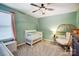 This bedroom boasts a wicker chair and a green-colored wall at 2222 Bluebell Way, Fort Mill, SC 29708