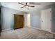 Bedroom with gray carpet and walls, ceiling fan, and a wardrobe at 2222 Bluebell Way, Fort Mill, SC 29708