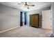 Bedroom with gray carpet, neutral walls, window with dark curtains, and a ceiling fan at 2222 Bluebell Way, Fort Mill, SC 29708