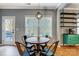 Cozy breakfast nook with a round table set, bright windows, and modern light fixture at 2222 Bluebell Way, Fort Mill, SC 29708