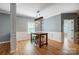 Dining room with modern industrial-style lighting fixture and seating for three at 2222 Bluebell Way, Fort Mill, SC 29708