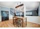 Dining room with modern industrial-style lighting fixture and seating for three at 2222 Bluebell Way, Fort Mill, SC 29708