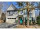 Charming two-story home with a blue front door, landscaped yard, and attached two-car garage at 2222 Bluebell Way, Fort Mill, SC 29708