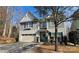 Charming two-story home with light gray siding, a front-facing garage, and a cheerful light blue front door at 2222 Bluebell Way, Fort Mill, SC 29708