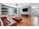 Cozy living room with built-in storage and shelving, plus a view of a mounted television at 2222 Bluebell Way, Fort Mill, SC 29708