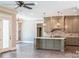 Open concept kitchen with light wood cabinets and a large island at 295 Tradition Dr, Mount Gilead, NC 27306