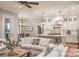 Open living space with white sofas and view into the kitchen at 295 Tradition Dr, Mount Gilead, NC 27306