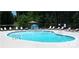 Inviting kidney-shaped pool with plenty of lounge chairs at 295 Tradition Dr, Mount Gilead, NC 27306