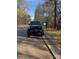 A black Jeep Wrangler parked on a tree-lined road at 295 Tradition Dr, Mount Gilead, NC 27306