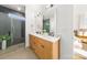 Modern bathroom with a dual vanity, glass shower enclosure, and sleek finishes at 3132 Carol Ave, Charlotte, NC 28208