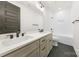 Modern bathroom featuring a double sink vanity, tiled shower, and soaking tub at 3132 Carol Ave, Charlotte, NC 28208