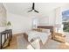 Cozy bedroom with a ceiling fan, light-colored walls, and wooden floors at 3132 Carol Ave, Charlotte, NC 28208