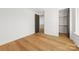 Bedroom featuring hardwood floors, a closet, and an exterior view at 3132 Carol Ave, Charlotte, NC 28208