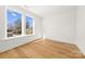 Bedroom with hardwood floors featuring a sunny window with a view of the neighborhood at 3132 Carol Ave, Charlotte, NC 28208