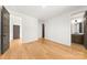 Bright bedroom boasts wood floors and multiple doors to bathrooms and hallways at 3132 Carol Ave, Charlotte, NC 28208