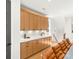 Dining area with built-in cabinets, hardwood floors, and modern decor at 3132 Carol Ave, Charlotte, NC 28208