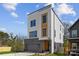 New construction boasts light siding, dark trim, and a one-car garage at 3132 Carol Ave, Charlotte, NC 28208