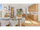 Modern kitchen featuring stainless steel appliances, hardwood floors, and a dining area at 3132 Carol Ave, Charlotte, NC 28208